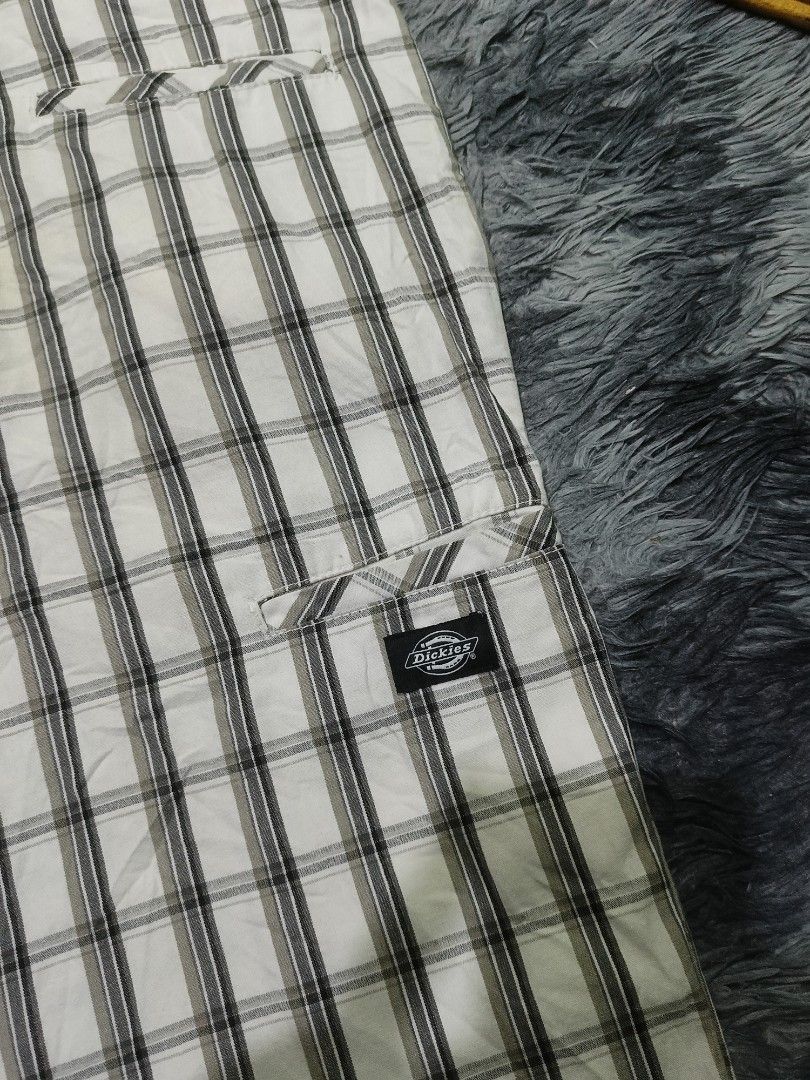 Dickies Plaid Cargo Shorts White Black (Category: Activewear) located in Las Pinas. Submitted by jowardbemi21707 (Listing ID 1471092726, Image 3). Description: Dickies plaid shorts in white and black tones. Classic check pattern throughout. Button closure up top with belt loops. Two back welt pockets with the signature Dickies logo tag on the right side. Mid-length cut, super versatile for daily wear. Clean stitching and solid construction..
