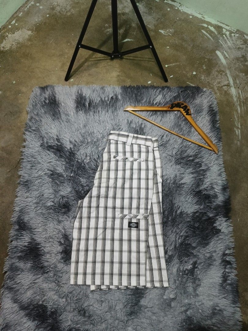 Dickies Plaid Cargo Shorts White Black (Category: Activewear) located in Las Pinas. Submitted by jowardbemi21707 (Listing ID 1471092726, Image 1). Description: Dickies plaid shorts in white and black tones. Classic check pattern throughout. Button closure up top with belt loops. Two back welt pockets with the signature Dickies logo tag on the right side. Mid-length cut, super versatile for daily wear. Clean stitching and solid construction..