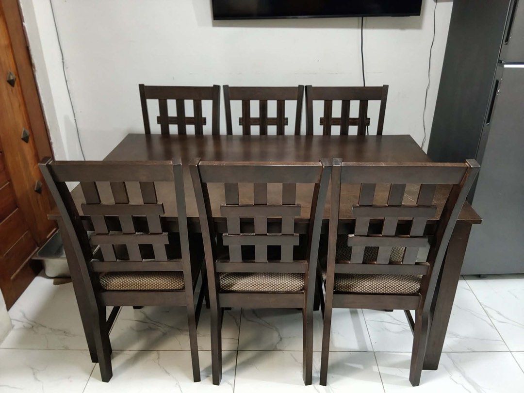 Dining Table Set with 6 Chairs (Category: Tables & Sets) located in Rosario. Submitted by mira33396 (Listing ID 1470986861, Image 1). Description: Classy Dining table with 6 Chairs -Made from Malaysian wood - Dark Brown -L x W x H (59” x 35.5” x 29”) - Pick-up only or lalamove - No top glass - with minimal scratches barely visible - with 6 chairs -no to low ballers RFS: masyado malaki para sa bahay namin. Location: San Agustin, Trece Martires Cav