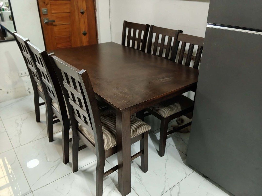 Dining Table Set with 6 Chairs (Category: Tables & Sets) located in Rosario. Submitted by mira33396 (Listing ID 1470986861, Image 2). Description: Classy Dining table with 6 Chairs -Made from Malaysian wood - Dark Brown -L x W x H (59” x 35.5” x 29”) - Pick-up only or lalamove - No top glass - with minimal scratches barely visible - with 6 chairs -no to low ballers RFS: masyado malaki para sa bahay namin. Location: San Agustin, Trece Martires Cav