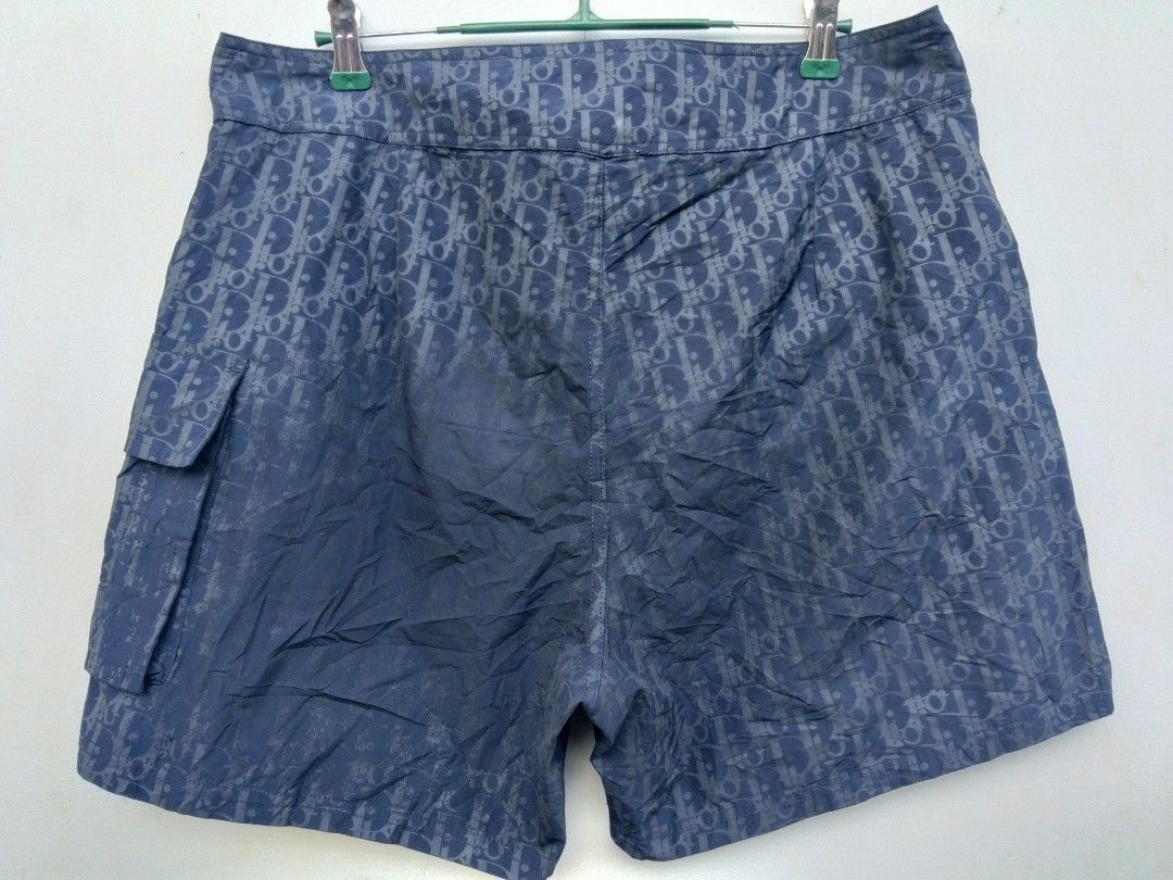 Dior Monogram Blue Cargo Board Shorts Swim Trunks (Category: Shorts) located in Manila. Submitted by austriakim18807 (Listing ID 1470934617, Image 2). Description: -Price: 5,000 -Width: 33-36 -Length: 16.5 - Authentic blue Dior monogram board shorts with all-over Oblique pattern - Adjustable drawstring waist equipped with branded metal aglets - Convenient side cargo pocket for small essentials - Lightweight and breathable fabric ideal for warm we