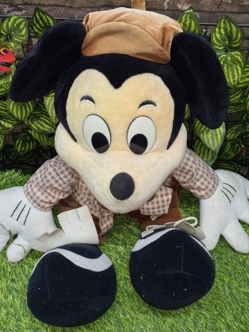 Disney Mickey Mouse plush toy in checkered jacket approx 55cm (Category: Plushies & Soft Toys) located in Paranaque City. Submitted by furugiyafinds (Listing ID 1471071806, Image 2). Description: 📌 Flaws last pic - Authentic Disney Mickey Mouse plush toy - Dressed in a stylish brown checkered jacket, vest, bow tie, and matching hat - Features iconic oversized white gloves, big plastic eyes, and a cute tail - Detailed with white fringe on the sho