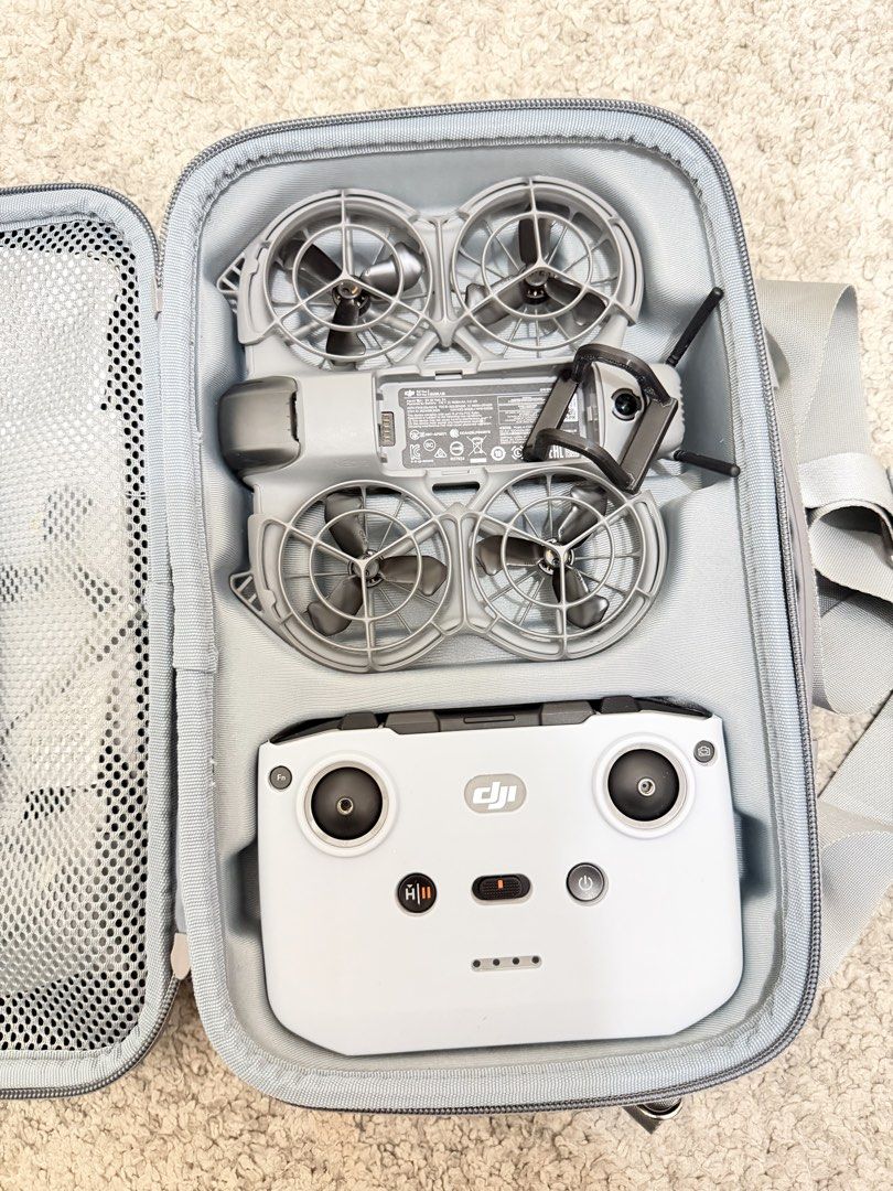 DJI Neo 2 Fly More Combo with Controller and Bag (Category: Drones) located in Quezon City. Submitted by nicoletted18798 (Listing ID 1471041300, Image 2). Description: - Complete DJI Neo drone set, perfect for quick flying trips - Includes DJI Neo drone and RC-N3 remote controller - Power-packed with 3 flight batteries and a charging hub - Comes with a stylish gray carrying case featuring a shoulder strap - Custom foam compartments keep everythin