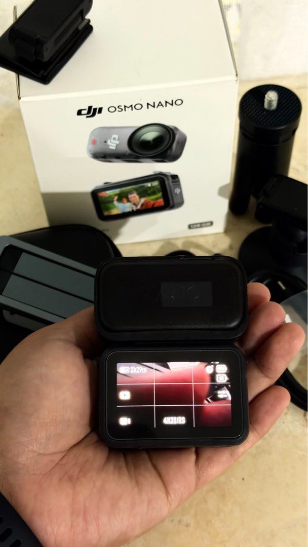 DJI Osmo Nano 128GB with DJI Mic Mini Transmitter (Category: Cameras) located in Caloocan City. Submitted by gelligadi (Listing ID 1471023044, Image 2). Description: - Model: DJI Osmo Nano Action Camera - Storage: 128GB capacity - Condition: Tested and working great, screen lights up clearly - Includes original retail box - Ulanzi MA37 quick release mini tripod included - Carrying case, magnetic mounts, and charging cable included - All accessori