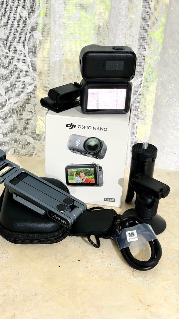 DJI Osmo Nano 128GB with DJI Mic Mini Transmitter (Category: Cameras) located in Caloocan City. Submitted by gelligadi (Listing ID 1471023044, Image 3). Description: - Model: DJI Osmo Nano Action Camera - Storage: 128GB capacity - Condition: Tested and working great, screen lights up clearly - Includes original retail box - Ulanzi MA37 quick release mini tripod included - Carrying case, magnetic mounts, and charging cable included - All accessori