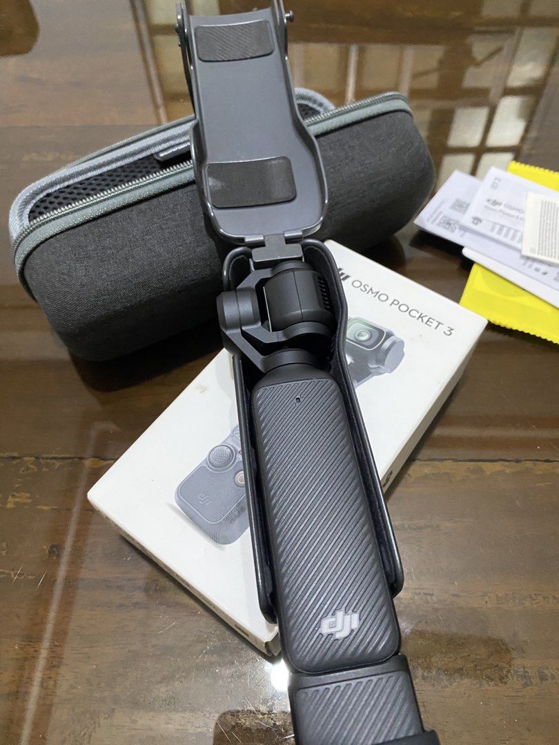 DJI Osmo Pocket 3 (Category: Video Cameras) located in Baguio. Submitted by masterroller (Listing ID 1470968452, Image 3). Description: - DJI Osmo Pocket 3 action camera setup in excellent working condition - Powers on properly and ready for 4K video recording - Screen rotates smoothly and all buttons click normally - Includes original box and protective carry case - Comes with Sunnylife storage case, manuals, and cleaning cloth - Complete with c