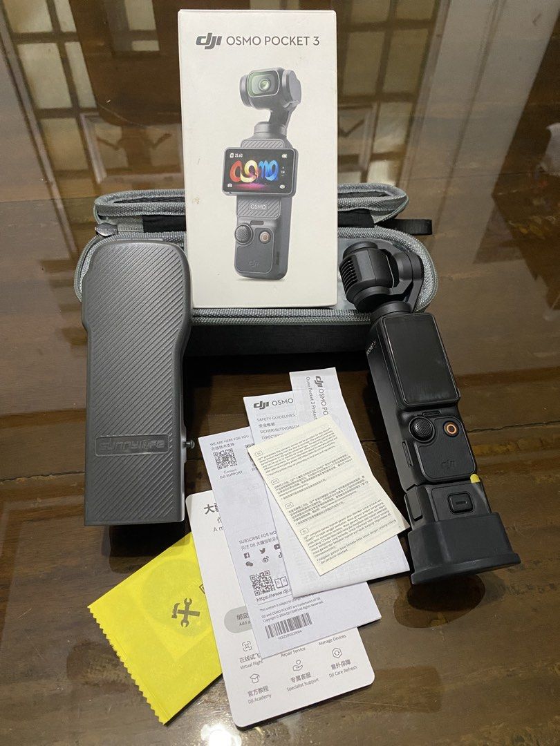 DJI Osmo Pocket 3 (Category: Video Cameras) located in Baguio. Submitted by masterroller (Listing ID 1470968452, Image 2). Description: - DJI Osmo Pocket 3 action camera setup in excellent working condition - Powers on properly and ready for 4K video recording - Screen rotates smoothly and all buttons click normally - Includes original box and protective carry case - Comes with Sunnylife storage case, manuals, and cleaning cloth - Complete with c
