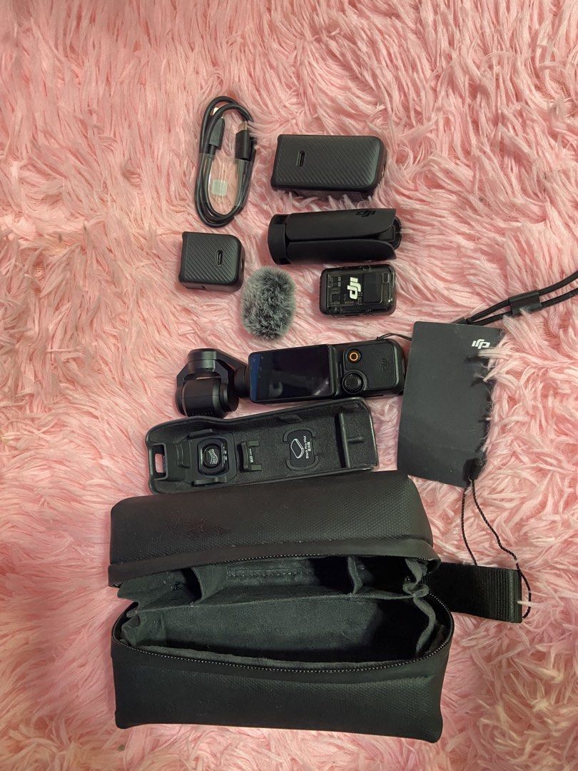 DJI Osmo Pocket 3 Creator Combo (Category: Cameras) located in Manila. Submitted by joyceeyyyy (Listing ID 1470957343, Image 1). Description: - Includes handheld gimbal camera and battery handle for extended shooting - DJI Mic 2 transmitter with furry windscreen and clip magnet for pro audio - Wide-angle lens and mini tripod included for versatile framing - Comes with original carrying bag, cables, power adapters, and retail box - Perfect all-in-