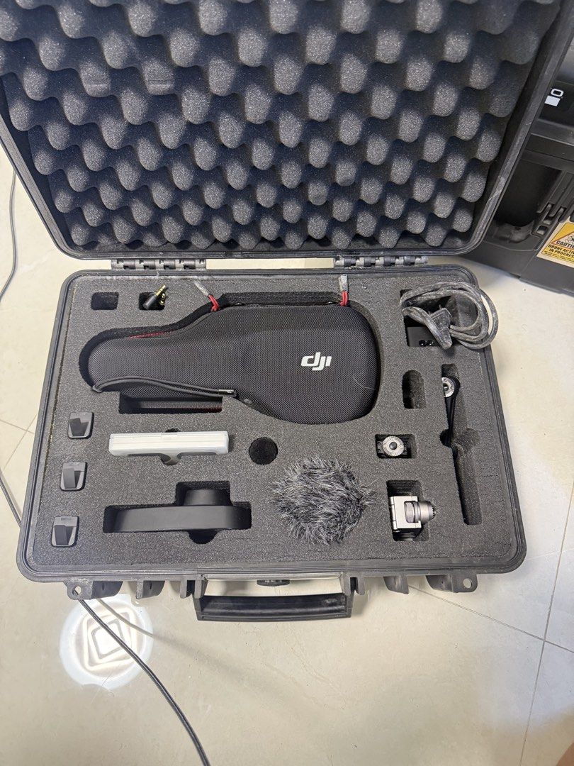 DJI Osmo Pocket Camera Stabilizer with Hard Case and Accessories (Category: Cameras) located in Manila. Submitted by pjaguilar436945 (Listing ID 1471012560, Image 2). Description: - Complete DJI Osmo camera gimbal setup - Includes handheld stabilizer and protective pouch - Comes with deadcat wind muff, cables, mounts, and small attachments - Everything packs securely into a custom hard foam case - Ideal for smooth, stable video shooting on the mo
