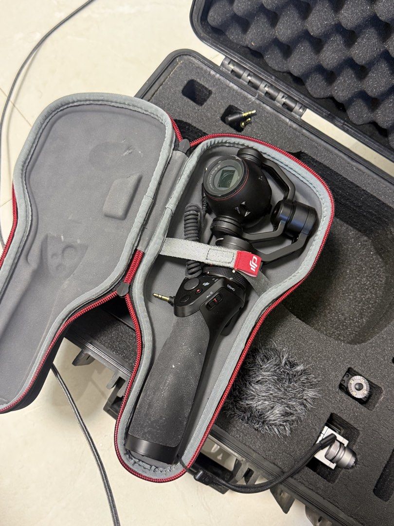 DJI Osmo Pocket Camera Stabilizer with Hard Case and Accessories (Category: Cameras) located in Manila. Submitted by pjaguilar436945 (Listing ID 1471012560, Image 1). Description: - Complete DJI Osmo camera gimbal setup - Includes handheld stabilizer and protective pouch - Comes with deadcat wind muff, cables, mounts, and small attachments - Everything packs securely into a custom hard foam case - Ideal for smooth, stable video shooting on the mo