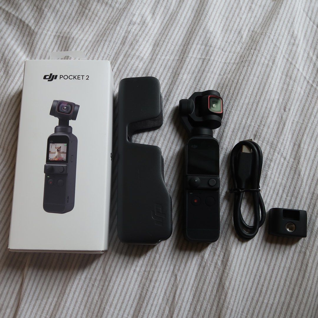 DJI Pocket 2 Camera with Case and Accessories (Category: Cameras) located in Manila. Submitted by mairalyng21434 (Listing ID 1471021597, Image 3). Description: - DJI Pocket 2 handheld camera - Shoots smooth, high-quality video in a pocket-sized design - Fully tested and 100% working condition - Includes protective case, charging cable, and tripod mount adapter - Original box included - RUSH SALE / PM for inquiries!.