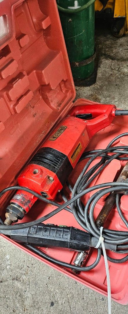 DKENG DK-101D Concrete Vibrator (Category: Construction Tools & Equipment) located in Cavite. Submitted by sunghanphil_31 (Listing ID 1470953446, Image 2). Description: - Brand: DKENG (Made in Korea) - Model: DK-101D Internal Concrete Vibrator - Power: 220V, 60Hz, 8.2A, 1800W motor (2700 min-1) - Features: Long heavy-duty power cable with inline control switch - Inclusion: Sturdy red storage carrying case - Condition: Used with signs of wear from