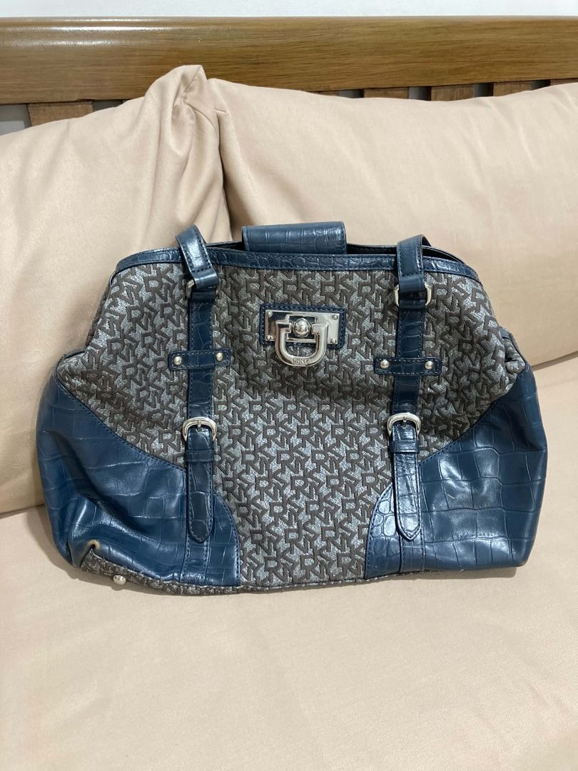 DKNY Logo Monogram Shoulder Bag with Blue Croc Trim (Category: Shoulder Bags) located in Manila. Submitted by faireeph (Listing ID 1471054468, Image 1). Description: - Brand: DKNY - Style: Shoulder bag - Material: Brown monogram fabric with blue faux crocodile embossed leather trim - Hardware: Silver-tone with signature front lock detail and branded turn lock clasp - Closure: Zip top - Interior: Lined in black fabric with DKNY logo plaque pocket 