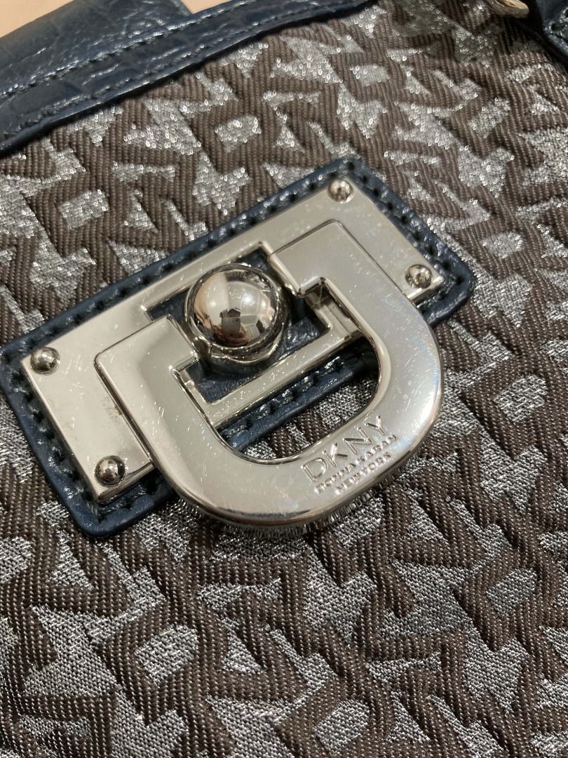 DKNY Logo Monogram Shoulder Bag with Blue Croc Trim (Category: Shoulder Bags) located in Manila. Submitted by faireeph (Listing ID 1471054468, Image 3). Description: - Brand: DKNY - Style: Shoulder bag - Material: Brown monogram fabric with blue faux crocodile embossed leather trim - Hardware: Silver-tone with signature front lock detail and branded turn lock clasp - Closure: Zip top - Interior: Lined in black fabric with DKNY logo plaque pocket 