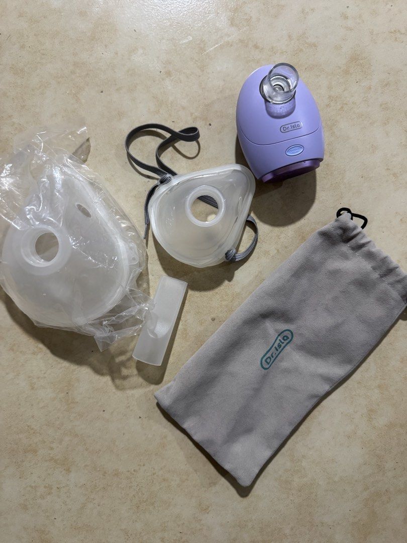 dr.isla Portable Handheld Mesh Nebulizer Machine (Category: Medical Supplies & Tools) located in Quezon City. Submitted by silvergem_96 (Listing ID 1471072299, Image 1). Description: - Brand: Dr.Isla - Color: Purple - Power Source: Battery or USB - Included: Adult mask, child mask, mouthpiece, and grey logo storage pouch - Condition note: One mask is still sealed in plastic - Portable and compact design, perfect for home or travel respiratory car