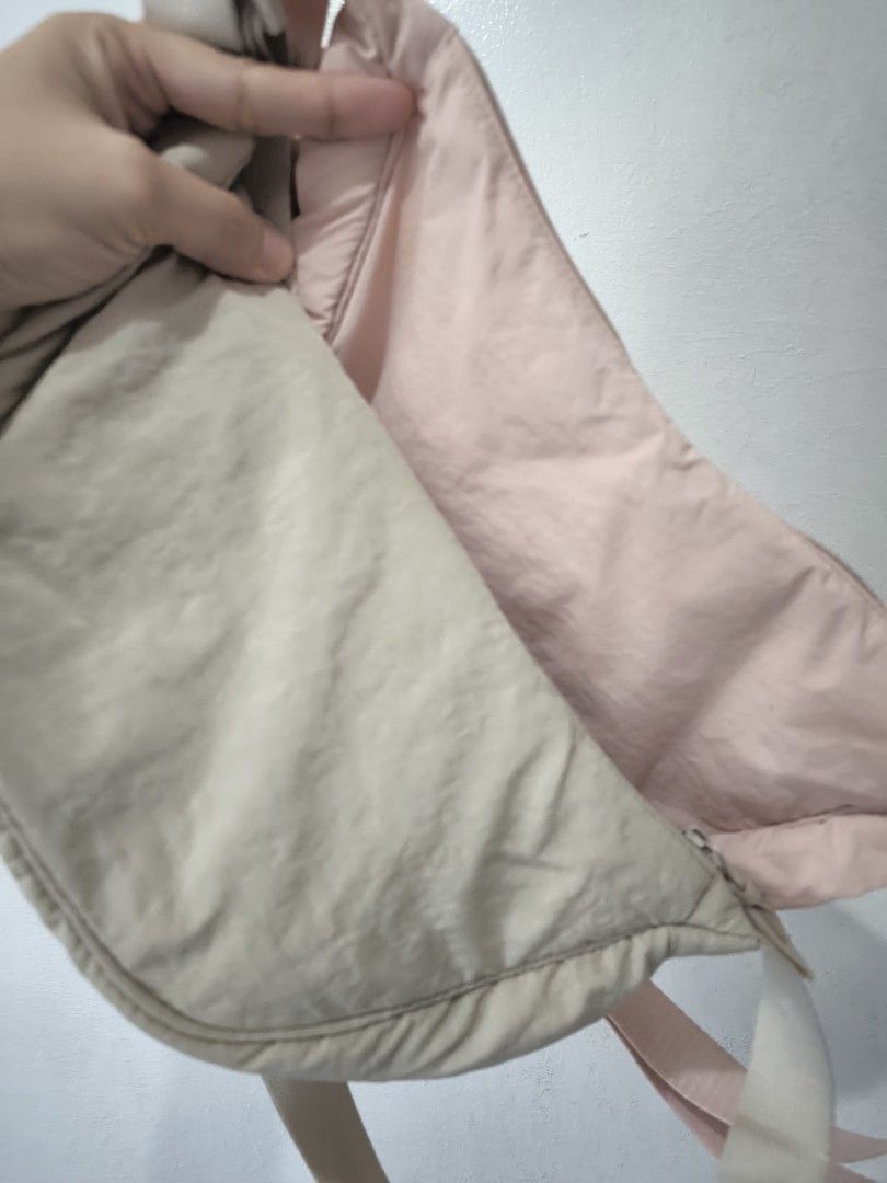 Dumpling bag (buy 1 take 1) (Category: Shoulder Bags) located in Taytay. Submitted by misspol (Listing ID 1470970104, Image 1). Description: - Made of lightweight, puffy quilted nylon fabric - Secure top zipper closure - Adjustable strap with slider buckle for a custom fit - Foldable and packable design for easy travel - Ideal lightweight everyday carryall declutering, 2 items for 300php.