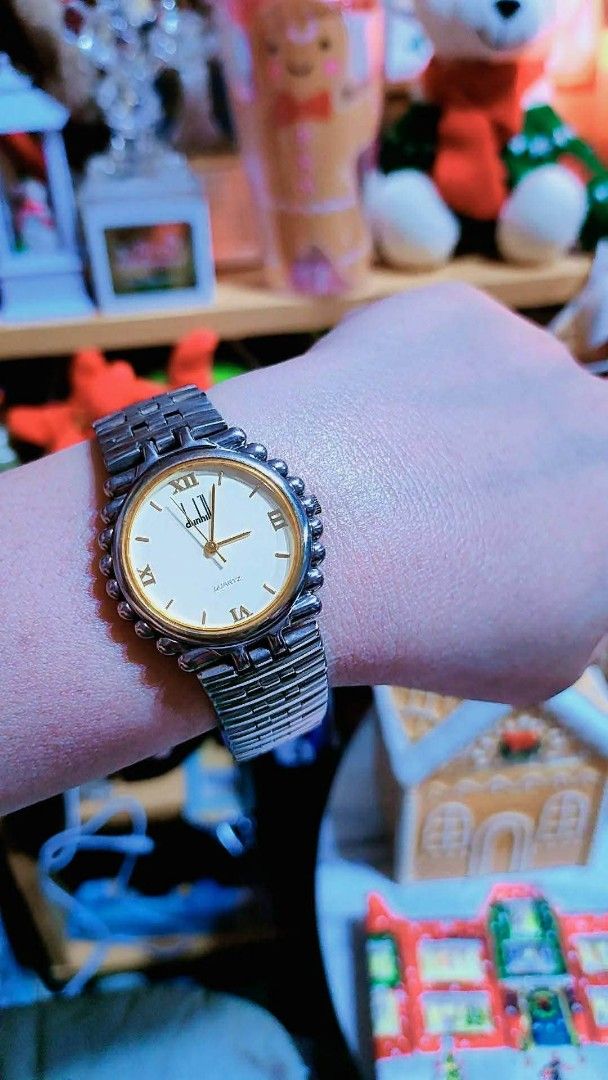 Dunhill Quartz Watch Two-Tone Roman Numeral Dial (Category: Luxury Watches) located in Baliuag. Submitted by marieannfernando23 (Listing ID 1471051069, Image 3). Description: - Brand: Dunhill - Movement: Battery-operated quartz - Dial: Round white dial with elegant gold Roman numerals - Bezel: Distinctive beaded bezel design - Strap: Two-tone silver and gold metal bracelet - Fit: Standard wrist size - Condition: Excellent working condition, ready