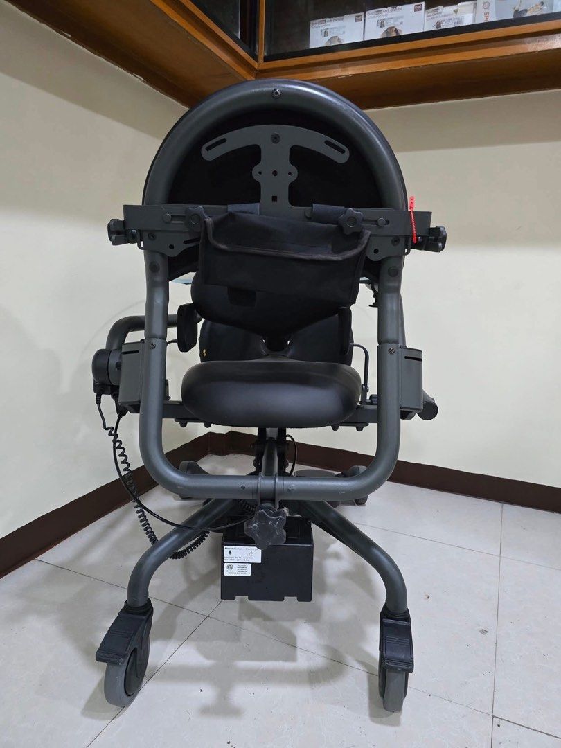 EasyStand Evolv Mobile Standing Wheelchair (Category: Wheelchairs) located in Manila. Submitted by calmdolphin.87b0e4 (Listing ID 1470955062, Image 1). Description: - Model: EasyStand Evolv motorized standing wheelchair - Color: Sleek dark grey - Lift Mechanism: Motorized with a rear-mounted battery pack and convenient hand control - Comfort & Support: Padded seat, backrest, knee supports, and adjustable armrests/footplates - Accessories: Include