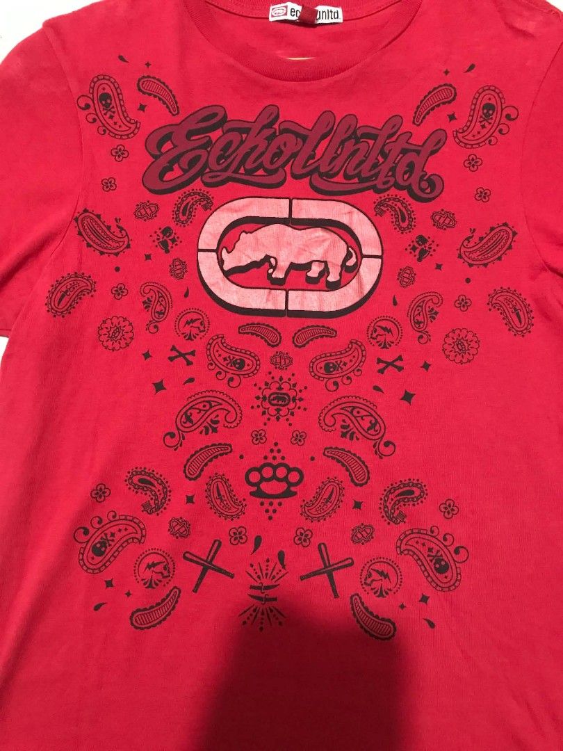 Ecko Unltd Red T-Shirt Size S (Category: Tshirts & Polo Shirts ) located in Manila. Submitted by mikeee03 (Listing ID 1471072036, Image 3). Description: - Brand: Ecko Unltd - Size: Small (S) - Design: Bold front logo with bandana graphic print - Fit/Material: Soft cotton, comfortable regular fit - Style: Short sleeves, crew neck, casual wear - Condition: Good - Ready to wear.
