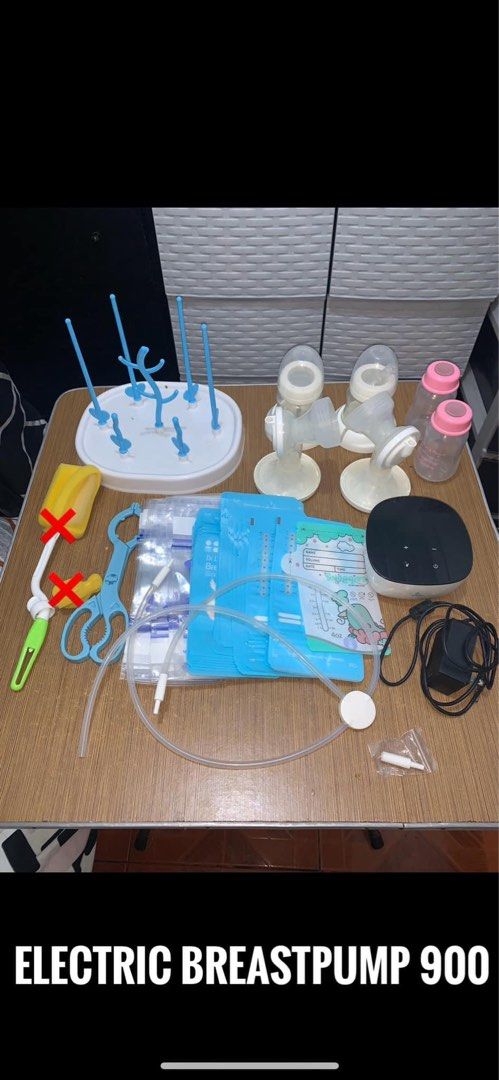 Electric Breastpump 900 with bottles and drying rack bundle (Category: Breastfeeding & Bottle Feeding) located in Manila. Submitted by mixi_lexi (Listing ID 1471080247, Image 1). Description: - Complete Electric Breastpump 900 set ready for immediate use - Includes motor unit, power adapter, clear tubing, and pump flanges - Comes with feeding/storage bottles, drying rack, storage bags, and bottle tongs - Everything pictured is included in this bu