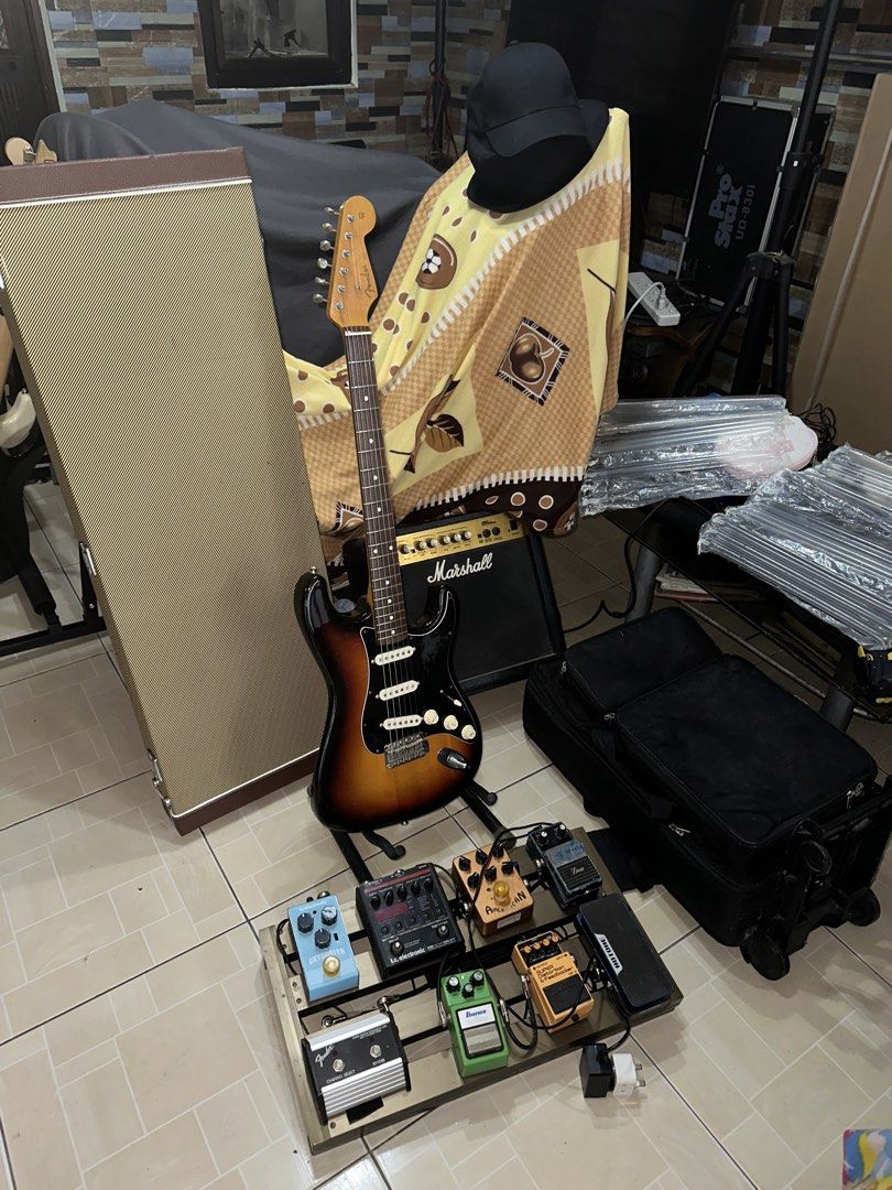 Electric Guitar Set for Sale as Pack (Category: Musical Instruments) located in Manila. Submitted by octabyosgoodolstuff (Listing ID 1471028115, Image 3). Description: Kindly Read Carefully TESTING WATERS AVAILABLE UNTIL NOV 23 2026 For Sale (Strickly as Pack) Take All for 80k As is Condition - Fender Japan ST62-70 (Fugijen) (1994-1995) -Analog Pedal Set with Power Station, Amp Switch, Trolly Case -Marshall 15w Amp -Sqoe Hard Case -Patch Cables A