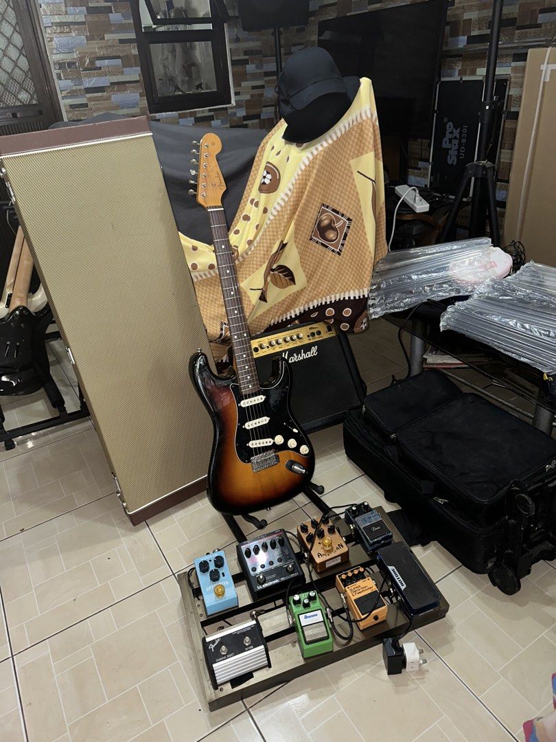 Electric Guitar Set for Sale as Pack (Category: Musical Instruments) located in Manila. Submitted by octabyosgoodolstuff (Listing ID 1471028115, Image 2). Description: Kindly Read Carefully TESTING WATERS AVAILABLE UNTIL NOV 23 2026 For Sale (Strickly as Pack) Take All for 80k As is Condition - Fender Japan ST62-70 (Fugijen) (1994-1995) -Analog Pedal Set with Power Station, Amp Switch, Trolly Case -Marshall 15w Amp -Sqoe Hard Case -Patch Cables A