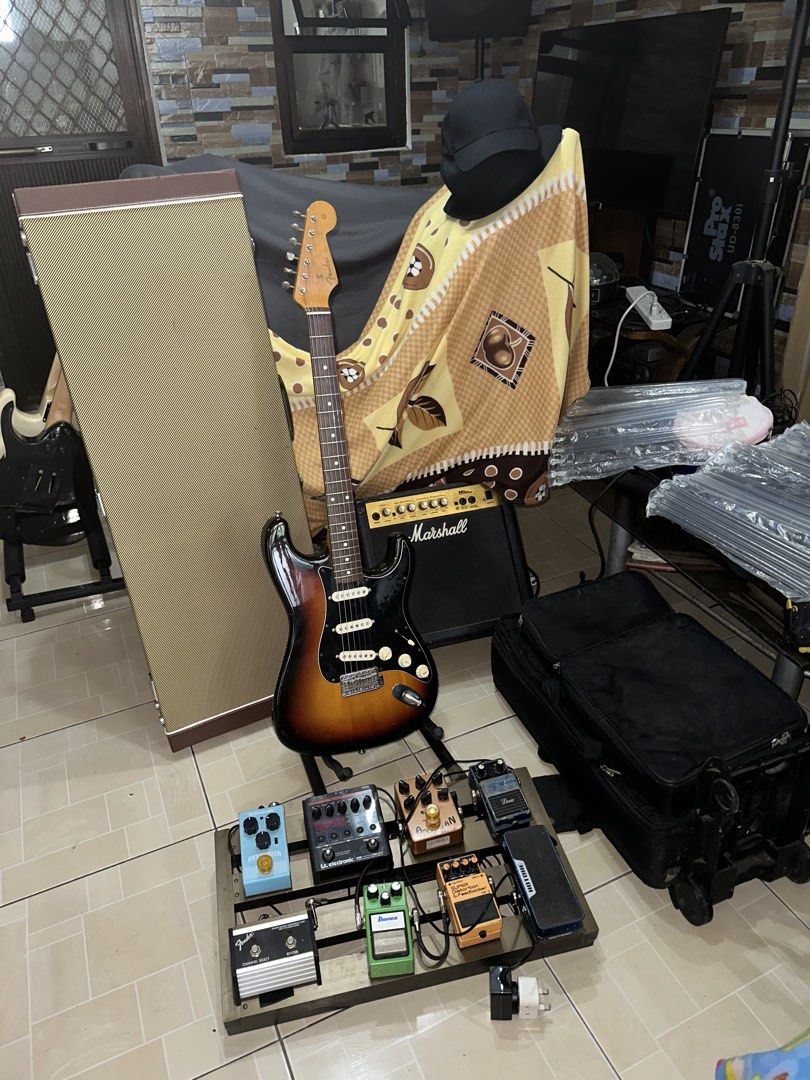 Electric Guitar Set for Sale as Pack (Category: Musical Instruments) located in Manila. Submitted by octabyosgoodolstuff (Listing ID 1471028115, Image 1). Description: Kindly Read Carefully TESTING WATERS AVAILABLE UNTIL NOV 23 2026 For Sale (Strickly as Pack) Take All for 80k As is Condition - Fender Japan ST62-70 (Fugijen) (1994-1995) -Analog Pedal Set with Power Station, Amp Switch, Trolly Case -Marshall 15w Amp -Sqoe Hard Case -Patch Cables A