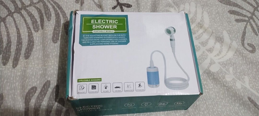Electric Shower Portable Mobile USB Charging Camping Bath (Category: Water Heater & Instant Showers) located in Makati City. Submitted by chamarket.2022 (Listing ID 1471091112, Image 1). Description: - Portable electric shower set ideal for camping, pets, and car washing - USB rechargeable with approx. 1 hour continuous runtime - Lightweight and travel-friendly at only 0.6kg - Complete set includes pump, hose, shower head, brush attachment, mount