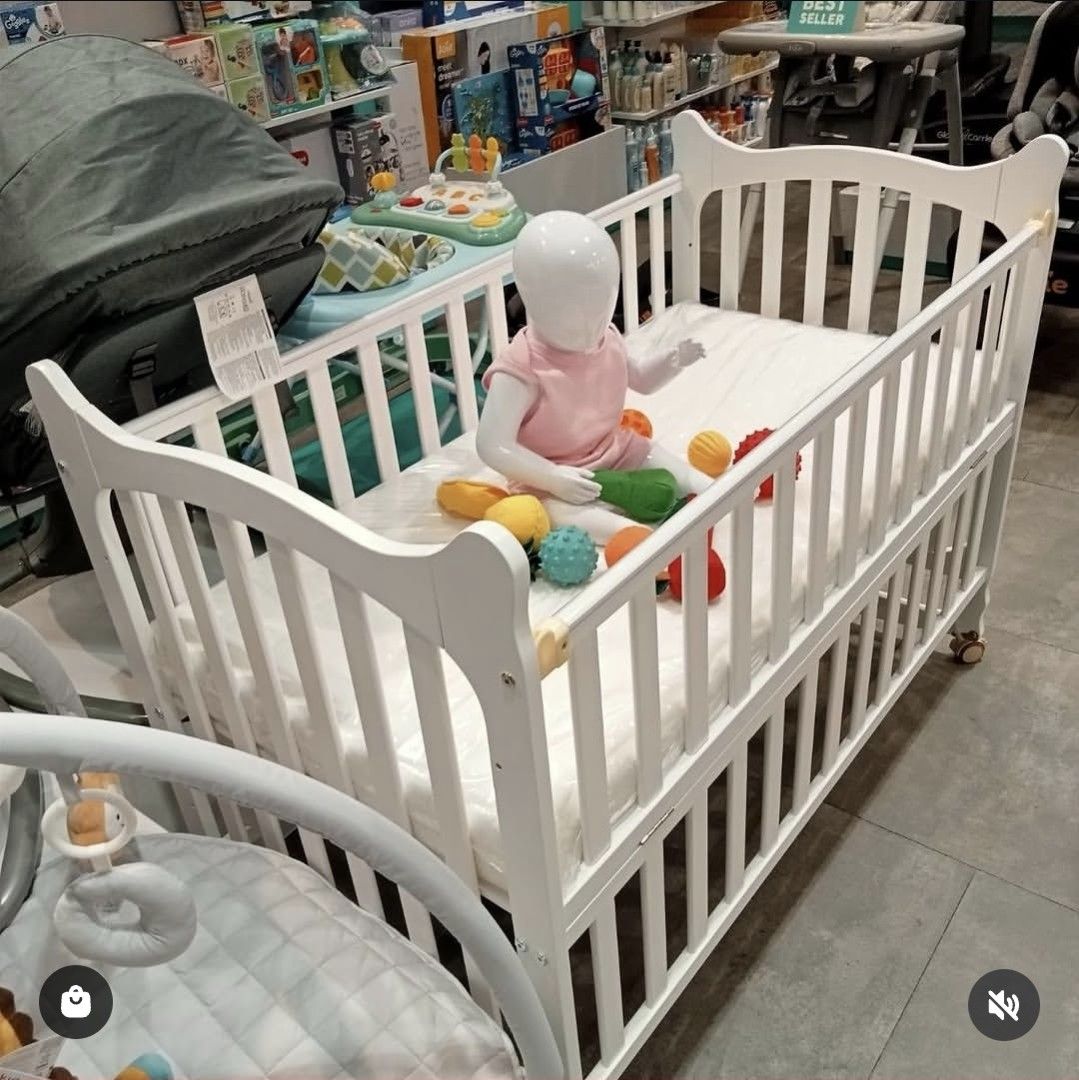 Ella Convertible Crib with Matress (Category: Cots & Cribs) located in Pasig City. Submitted by momofwillow (Listing ID 1471013244, Image 1). Description: 🔄 Multi-functional 4-in-1 Configurations The crib transitions seamlessly across four distinct stages: 1. Infant Crib: A fully enclosed secure sleeping area for newborns and infants. 2. Co-Sleeper / Bedside Sidecar: Side rail drops down to securely align right against the parents' bed. 3. Rocke