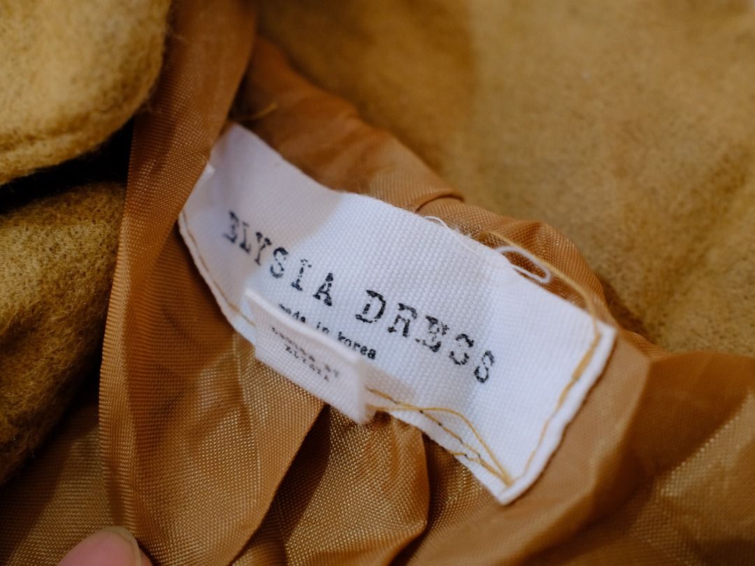 Elysia Dress Mustard Long Coat Jacket (Category: Coats, Jackets and Outerwear) located in Obando. Submitted by chokbotsss (Listing ID 1471011266, Image 3). Description: Pre-Loved Clothes - Price: 300 - Brand: Elysia Dress - Color: Mustar/Brown - Size: N/A - Issue: None Notes: Perfect for Autumn or Spring travel Payment: Gcash/Bank Transfer Delivery: Lalamove/LBC Location: Maysilo, Malabon City.