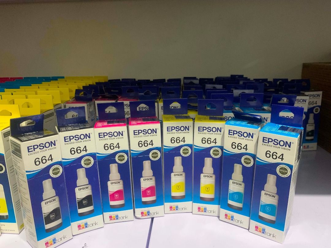 Epson 664 EcoTank Ink Set CMYK (Category: Printers, Scanners & Copiers) located in Quezon City. Submitted by inksource123 (Listing ID 1470953459, Image 3). Description: - Product: Full set of Epson 664 EcoTank ink bottles (Black, Cyan, Yellow, Magenta) - Condition: 100% brand new, unopened boxes - Storage: Properly stored on shelf, guaranteed fresh and high quality - Compatibility: Standard capacity refill bottles for compatible Epson printers - 