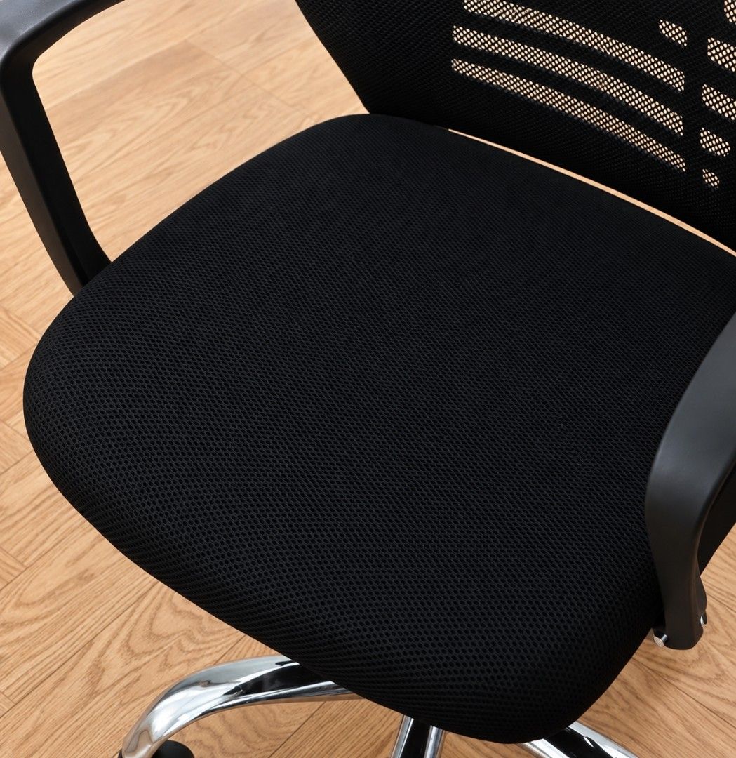 Ergonomic Mesh Office Chair with Headrest and Wheels (Category: Office Furniture & Fixtures) located in Manila. Submitted by doraemmonn (Listing ID 1470977264, Image 2). Description: - Color: Black - Material: Breathable mesh backrest and padded fabric seat - Headrest: Adjustable for neck support - Base: Chrome metal base with smooth caster wheels - Arms: Solid fixed armrests - Function: Height adjustment lever for custom seating - Perfect for: H