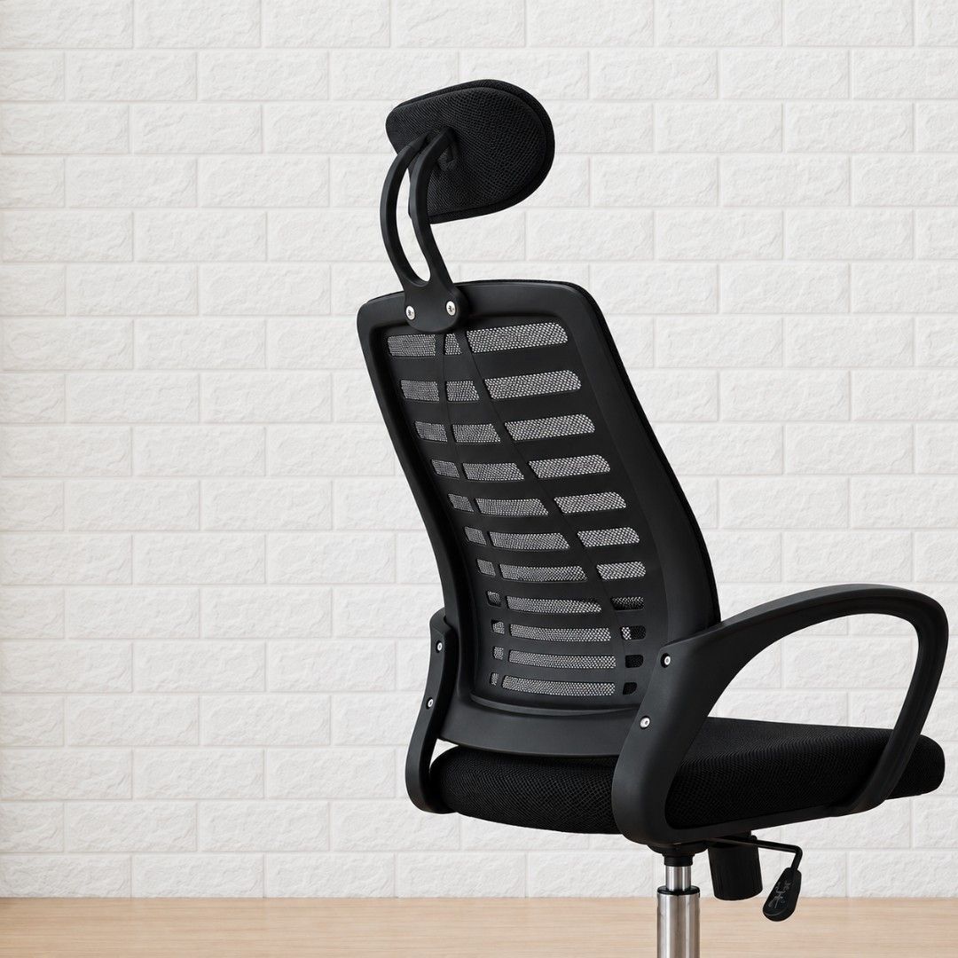 Ergonomic Mesh Office Chair with Headrest and Wheels (Category: Office Furniture & Fixtures) located in Manila. Submitted by doraemmonn (Listing ID 1470977264, Image 3). Description: - Color: Black - Material: Breathable mesh backrest and padded fabric seat - Headrest: Adjustable for neck support - Base: Chrome metal base with smooth caster wheels - Arms: Solid fixed armrests - Function: Height adjustment lever for custom seating - Perfect for: H