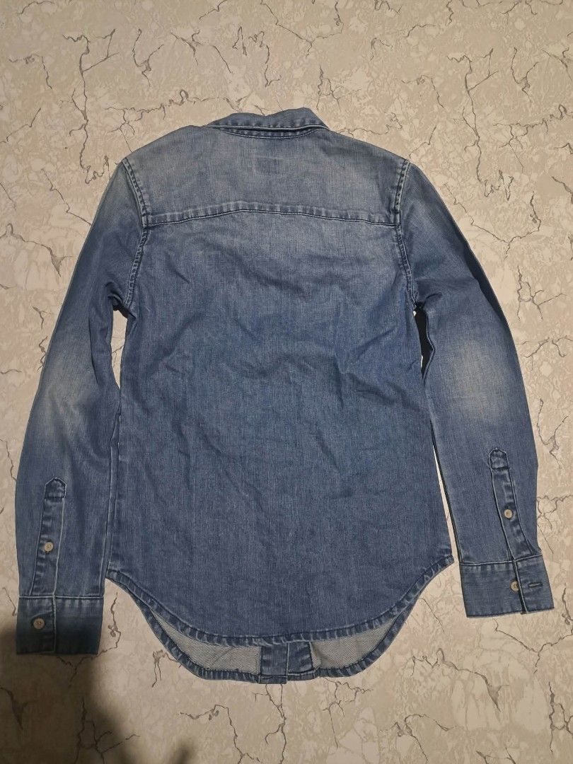 Evisu Women's Denim Jacket Size XS (Category: Coats, Jackets and Outerwear) located in Manila. Submitted by alexson10 (Listing ID 1471069605, Image 2). Description: - Brand: Evisu (Custom-made denim jacket) - Color: Classic blue wash with red embroidery near hem - Size: Women's Extra Small (Tag: 155/88A) - Dimensions: 16 inches width, 24 inches length - Features: Button-up closure, two front chest pockets, button cuffs - Condition: Good, DM for a