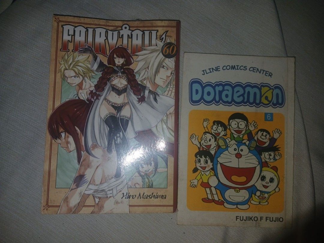 Fairy Tail Volume 60 and Doraemon Volume 6 & 7Manga (Bundle) (Category: Comics & Manga) located in Manila. Submitted by bluecurryc30065 (Listing ID 1471023703, Image 1). Description: - Manga bundle: Fairy Tail Vol. 60 (Hiro Mashima) and Doraemon Vol. 6 (Jline Comics Center edition) - Condition: Slight edge wear and page yellowing due to reading and storage - Selling as a set - Great for manga collectors and fans.