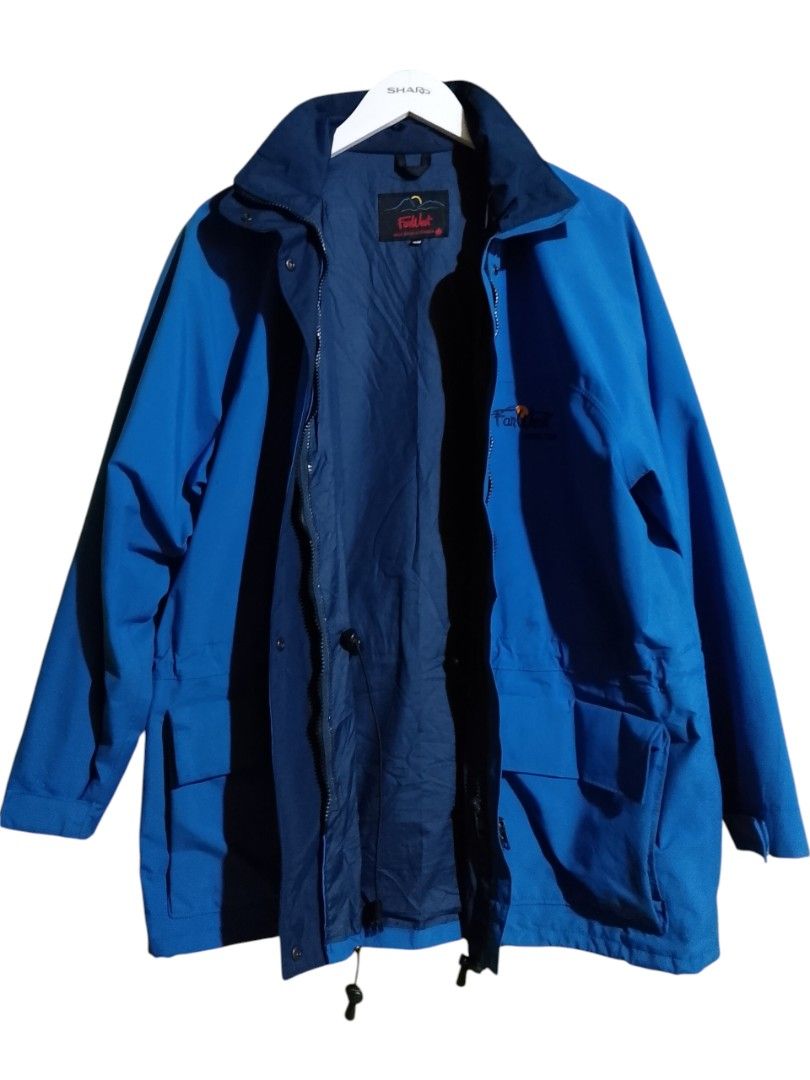FarWest Gore-Tex Blue Waterproof Windbreaker Jacket (Category: Coats, Jackets and Outerwear) located in Baler. Submitted by vansonearth (Listing ID 1470971004, Image 2). Description: Bright blue FarWest Gore-Tex jacket. Embroidered logo on the chest. Full zip front with snap button storm flap. Two large lower flap pockets and an inner zippered pocket. Drawstrings at the waist and hem to adjust fit. Navy interior lining and collar..