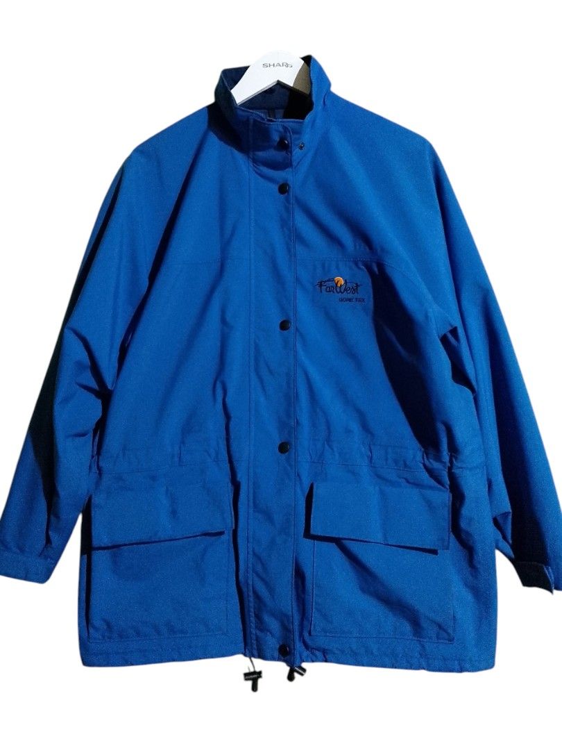FarWest Gore-Tex Blue Waterproof Windbreaker Jacket (Category: Coats, Jackets and Outerwear) located in Baler. Submitted by vansonearth (Listing ID 1470971004, Image 1). Description: Bright blue FarWest Gore-Tex jacket. Embroidered logo on the chest. Full zip front with snap button storm flap. Two large lower flap pockets and an inner zippered pocket. Drawstrings at the waist and hem to adjust fit. Navy interior lining and collar..