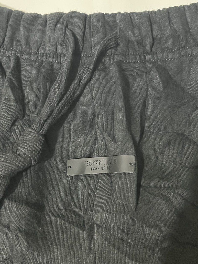 Fear of God Essentials Black State Shorts (Category: Shorts) located in Pilar. Submitted by fast-flip-ni-miko. (Listing ID 1471069015, Image 3). Description: - Brand: Fear of God Essentials - Color: Classic Black - Material: Premium cotton fleece for ultimate comfort - Waistband: Elastic with extra-long matching drawstrings - Branding: Rubberized Essentials label on front waistband & gold 'Fear of God State' print on left leg - Authenticity: Incl