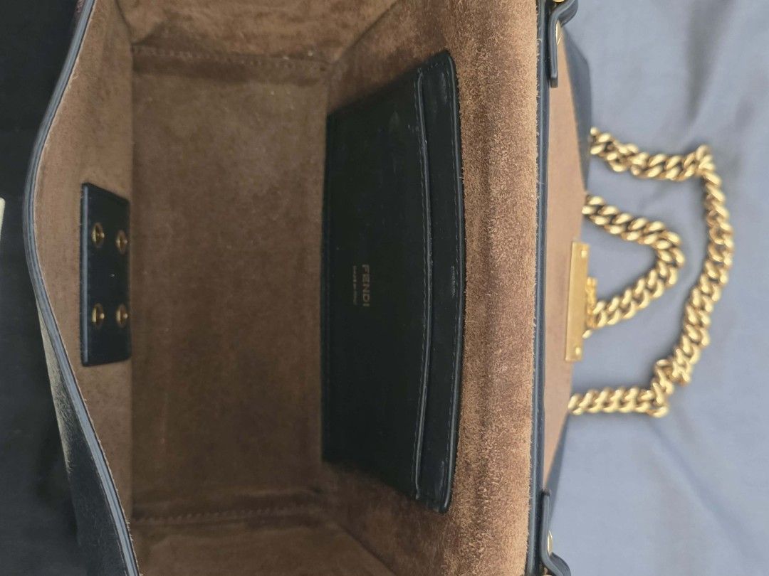 Fendi Small Kan U Shoulder Bag (Category: Luxury Bags & Wallets) located in Marikina City. Submitted by concuorebianco (Listing ID 1471099238, Image 3). Description: - Fendi Small Kan U Shoulder Bag - Black leather with gold-tone hardware with signature Fendi lock closure - Shoulder Bag / Crossbody Bag - Comes with dust bag and card - Good condition - bought 2019.