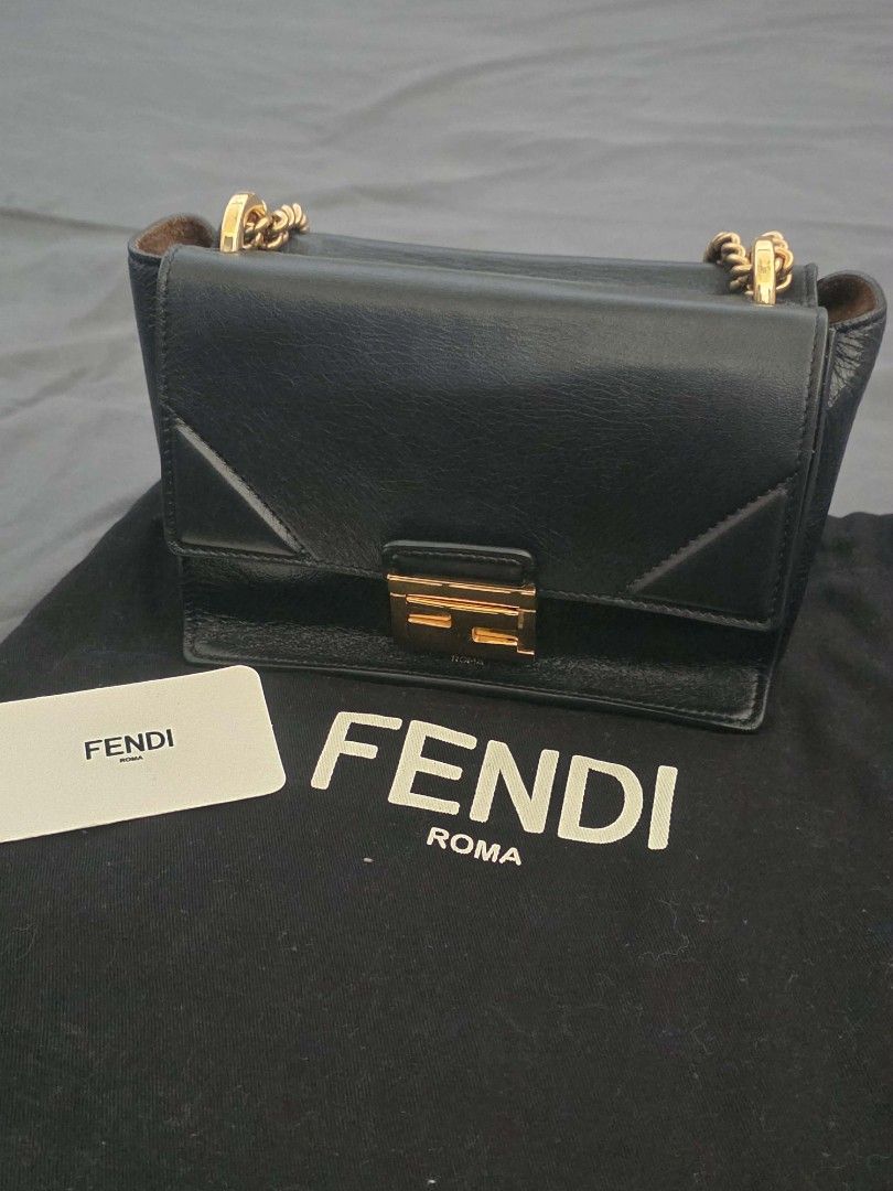 Fendi Small Kan U Shoulder Bag (Category: Luxury Bags & Wallets) located in Marikina City. Submitted by concuorebianco (Listing ID 1471099238, Image 2). Description: - Fendi Small Kan U Shoulder Bag - Black leather with gold-tone hardware with signature Fendi lock closure - Shoulder Bag / Crossbody Bag - Comes with dust bag and card - Good condition - bought 2019.