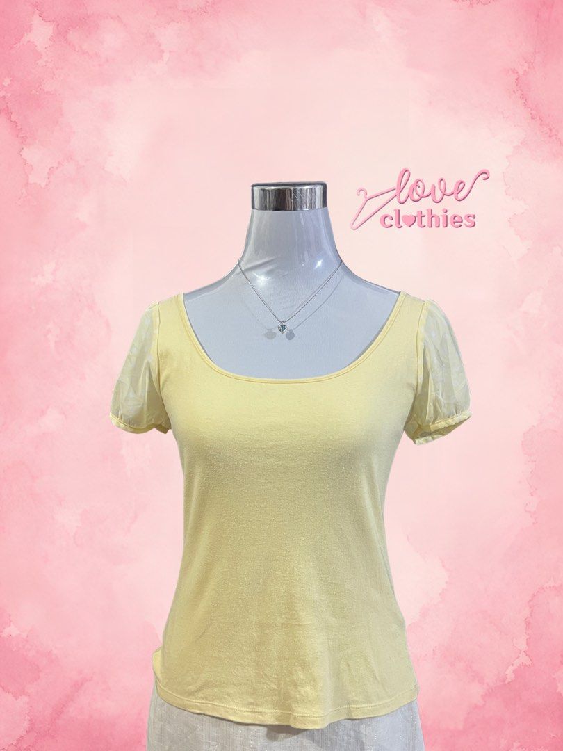 Feroux Yellow Short Sleeve Bow Back Top (Category: Blouses) located in Tuguegarao City. Submitted by love_clothies (Listing ID 1471068942, Image 1). Description: - Brand: Feroux - Color: Yellow - Style: Short sleeve top with scoop neckline - Details: Sheer puff sleeves with subtle dot pattern and large open-back bow tie - Material: Comfortable cotton body with polyester contrast - Fit: Relaxed and comfortable - Origin: Made in China.