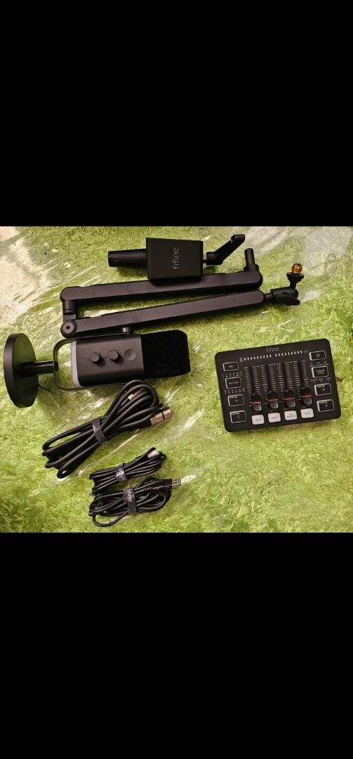 Fifine Microphone Audio Mixer and Arm Stand Set (Category: Microphones) located in Muntinlupa City. Submitted by wsgb1227 (Listing ID 1471080976, Image 1). Description: - Complete audio setup for podcasting, streaming, and voice recording - Includes Fifine microphone, audio mixer console, and adjustable desk arm stand - Comes with all necessary connecting cables - 100% tested and working properly - Clean and well-maintained condition.