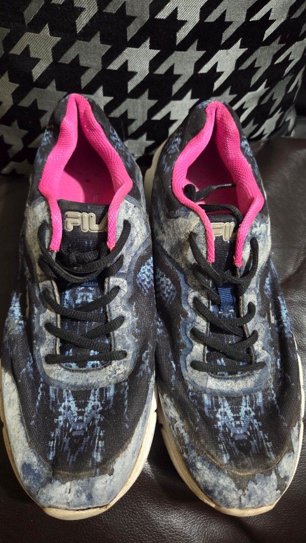 Fila Running Shoes Blue Pink Black (Category: Sneakers) located in Quezon City. Submitted by kctheexplorer05 (Listing ID 1471099606, Image 2). Description: Fila athletic sneakers with a blue and black pattern and hot pink lining. Black laces up front, white foam soles with pink and dark rubber tread underneath. Used condition with some wear on the fabric and soles. see photo for flaws WYIWYG .