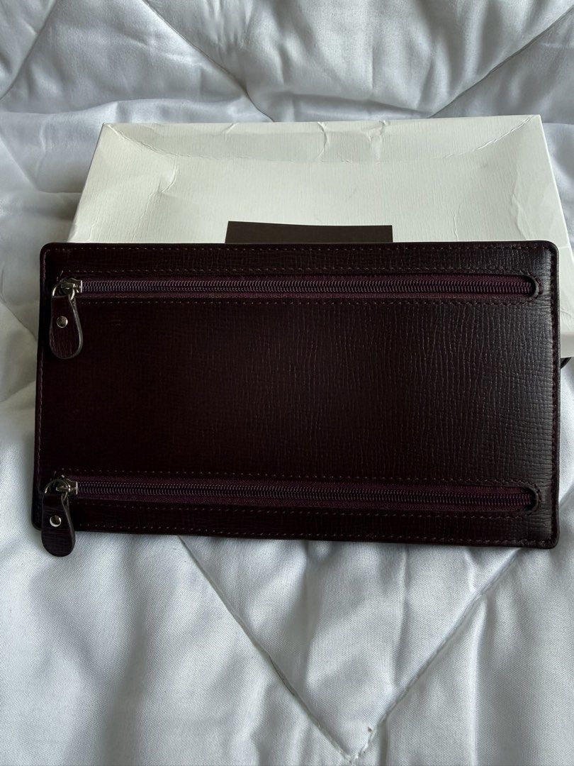 Fino Leatherware (Category: Wallets & Card holders) located in Pasig City. Submitted by weng0952 (Listing ID 1471027983, Image 1). Description: - Brand: Fino Leatherware - Color: Burgundy( red wine)with quality textured leather construction - Storage: Multiple exterior zippered pockets, interior card slots, and main cash compartment - Inclusions: Comes with original white presentation box - Condition: Excellent, well-maintained - Shipping: Fast s
