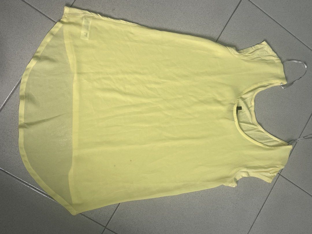 FOREVER21 Yellow Blouse - Sheer Back (Category: Blouses) located in Batangas. Submitted by alaisaampa7513 (Listing ID 1471028993, Image 2). Description: - Brand: Forever 21 - Size: Medium (tag attached) - Color: Bright yellow - Style: Scoop neck, short cap sleeves, high-low hemline (longer back) - Fabric: Lightweight, slightly sheer (back).