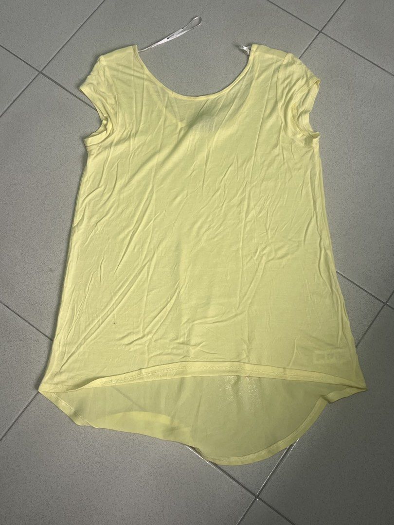 FOREVER21 Yellow Blouse - Sheer Back (Category: Blouses) located in Batangas. Submitted by alaisaampa7513 (Listing ID 1471028993, Image 1). Description: - Brand: Forever 21 - Size: Medium (tag attached) - Color: Bright yellow - Style: Scoop neck, short cap sleeves, high-low hemline (longer back) - Fabric: Lightweight, slightly sheer (back).