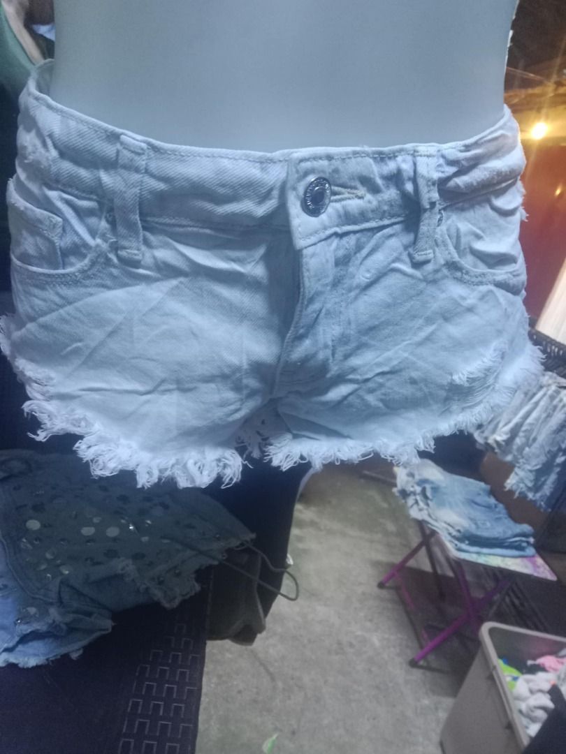 Forever 21 White Distressed Denim Shorts Size 24 (Category: Shorts) located in Quezon City. Submitted by honeyonline.ph (Listing ID 1471047220, Image 1). Description: - Brand: Forever 21 - Size: 24 - Color: Light wash white denim - Style: Raw hem with frayed edges and front distressed details - Design: Classic five-pocket styling with button and zip fly closure - Origin: Made in Pakistan - Condition: Excellent pre-loved or brand new (ready to wea