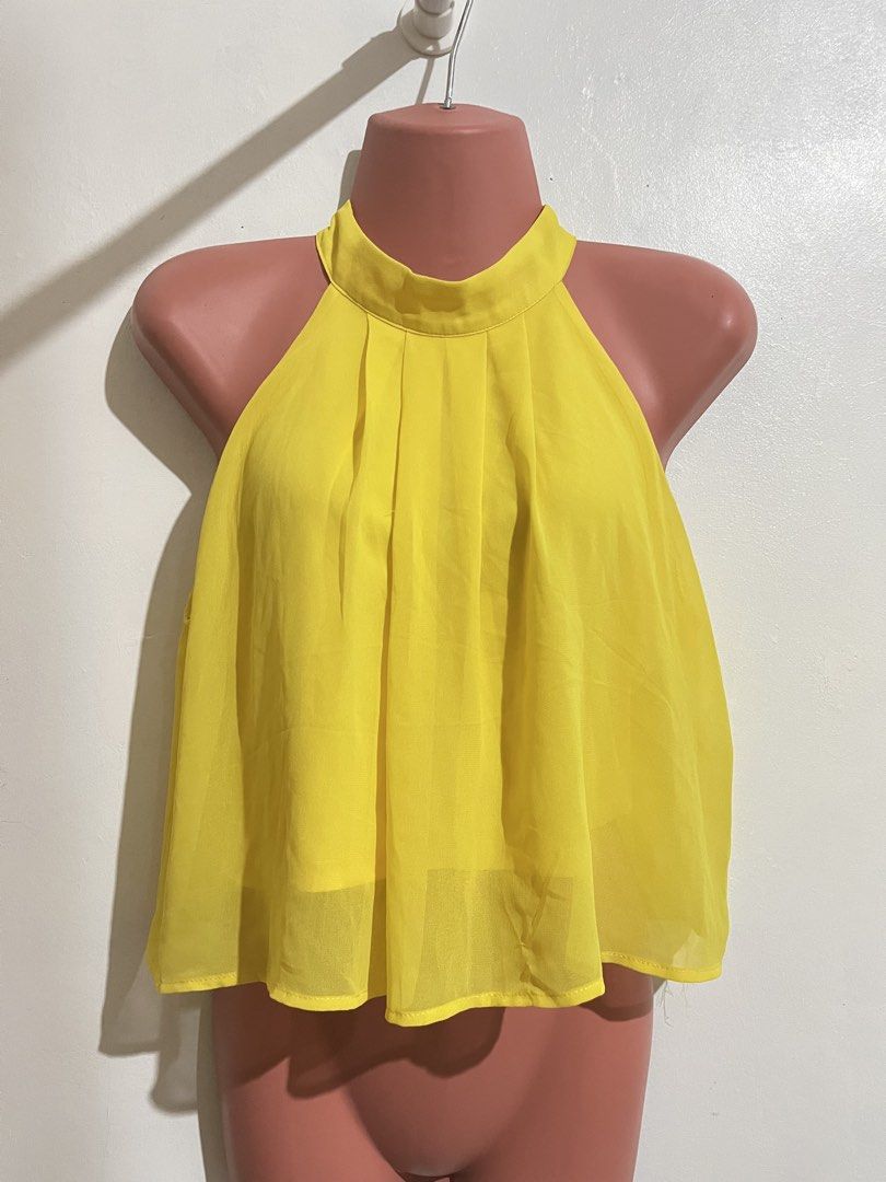 Forever 21 Yellow Halter Top (Category: Sleeveless) located in Cabanatuan. Submitted by winx_closeth (Listing ID 1471016543, Image 1). Description: Flaw: stain (not sure if washable) Xs-small.