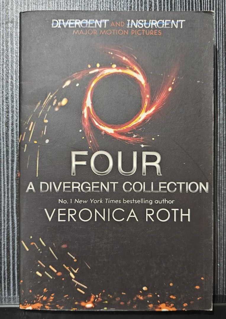 Four: A Divergent Collection by Veronica Roth paperback (Category: Storybooks) located in Mandaluyong City. Submitted by mjymoon (Listing ID 1471062980, Image 1). Description: - Title: Four: A Divergent Collection by Veronica Roth - Format: Paperback - Content: Short stories and scenes focusing on Tobias Prior before and after Divergent - Condition: Minor cover wear and creasing, with some page yellowing from age - Perfect for fans looking to div