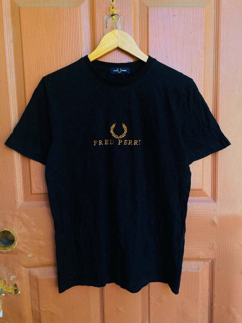 Fred Perry Black Embroidered Logo T-Shirt (Category: Tshirts & Polo Shirts ) located in Digos. Submitted by thrifthed.ph (Listing ID 1471021693, Image 1). Description: - Brand: Fred Perry - Color: Solid Black - Size: Standard Fit -med -dimes:20/28 -like new -no issue -cl:9.8:10 -need wash -authentic -complete tags -solid condi -solid colorate -authentic -suitable for picky buyer -no return no exchange - Material: 100% Cotton (Machine washable) - 